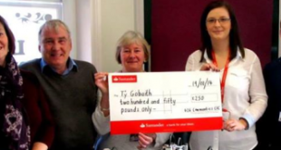G2G Communities CIC Director Moira Lockitt handed over a cheque for £250